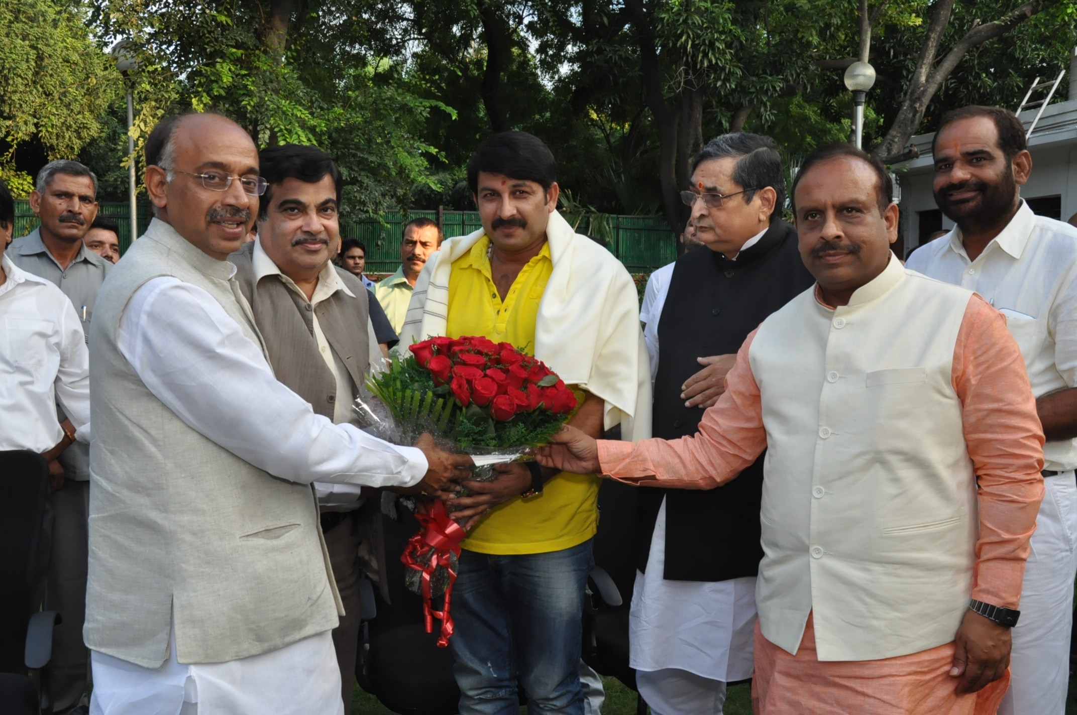 Former BJP President, Shri Nitin Gadkari, congratulating Shri Manoj Tiwari, Bhojpuri superstar after joining Bhartiya Janata Party at 13, Teen Murti Lane on October 03, 2013