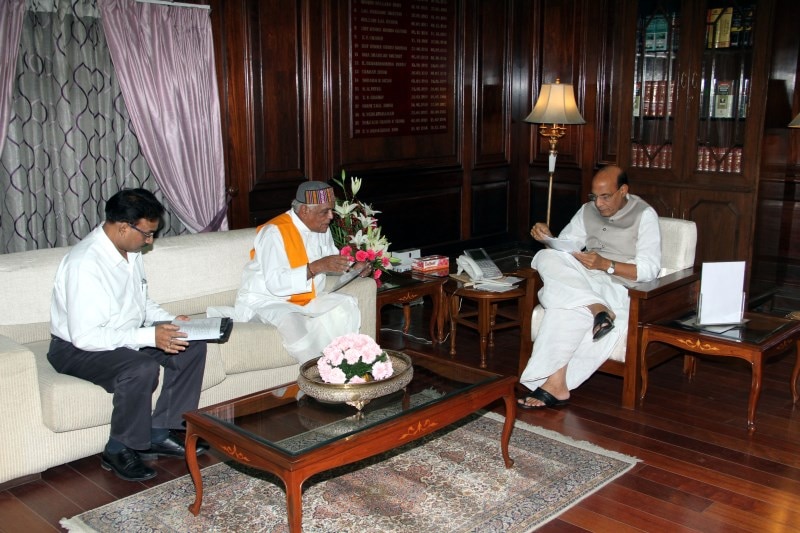 Union Home Minister Shri Rajnath Singh meeting with the Home Minister of Madhya Pradesh Shri Babulal Gaur at North Block (New Delhi) 12 June 2014